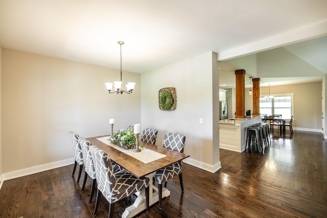 725B N Russell St, Portland, TN 37148 - dining area featuring a chandelier, baseboards, and dark wood-style floors