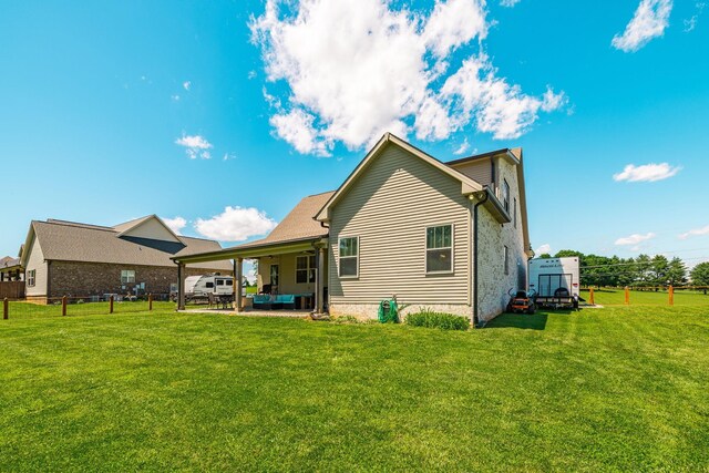 725B N Russell St, Portland, TN 37148 - rear view of house with an outdoor hangout area and a patio area