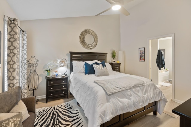 2020 Caladonia Way, Smyrna, TN 37167 - bedroom featuring vaulted ceiling, ensuite bath, baseboards, and light wood-style floors