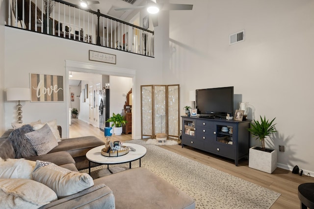 2020 Caladonia Way, Smyrna, TN 37167 - living area with a high ceiling, wood finished floors, a ceiling fan, and baseboards