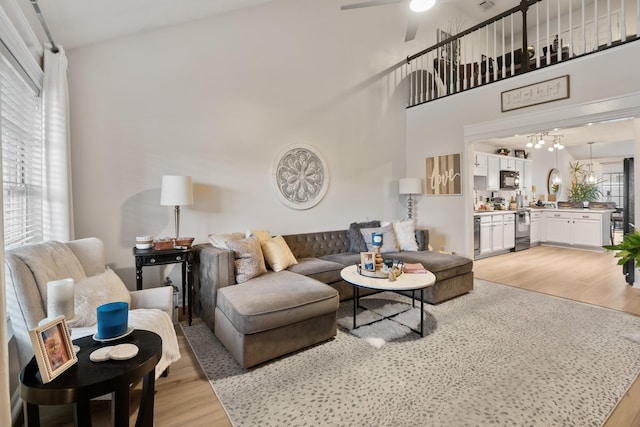 2020 Caladonia Way, Smyrna, TN 37167 - living area featuring light wood-type flooring, ceiling fan, and a chandelier