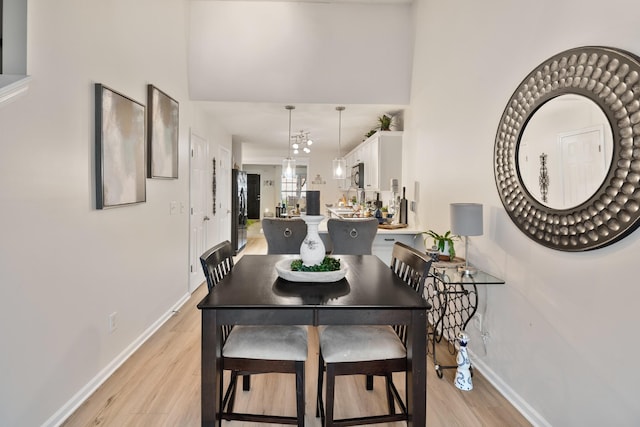 2020 Caladonia Way, Smyrna, TN 37167 - dining area with light wood finished floors, baseboards, and a towering ceiling