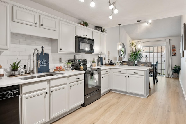 2020 Caladonia Way, Smyrna, TN 37167 - kitchen featuring black appliances, backsplash, a peninsula, a sink, and lofted ceiling