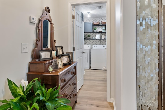 2020 Caladonia Way, Smyrna, TN 37167 - hall featuring washer and dryer, light wood-style flooring, and baseboards
