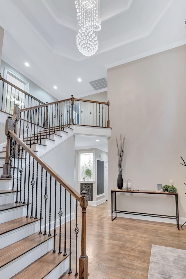 3168 Appian Way, Spring Hill, TN 37174 - stairs featuring healthy amount of natural light, recessed lighting, a chandelier, crown molding, and wood finished floors