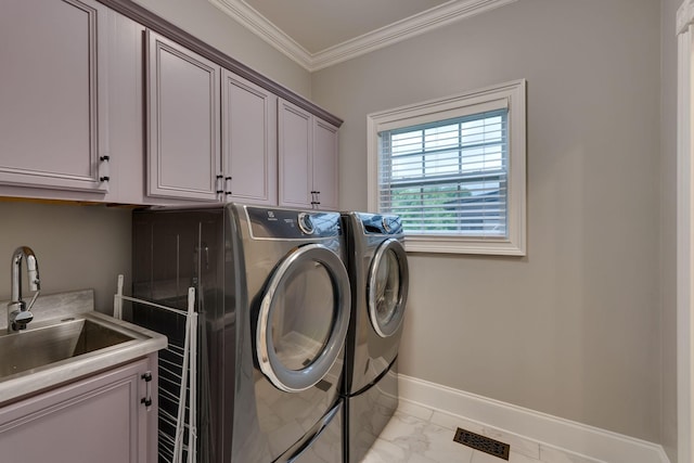 3168 Appian Way, Spring Hill, TN 37174 - laundry room with washing machine and clothes dryer, cabinet space, light marble finish floors, crown molding, and baseboards