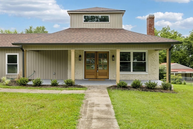 1775 Hayshed Rd, Charlotte, TN 37036 - view of front facade featuring a chimney, roof with shingles, a front yard, a porch, and board and batten siding