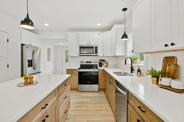 1775 Hayshed Rd, Charlotte, TN 37036 - kitchen featuring appliances with stainless steel finishes, light wood finished floors, recessed lighting, light countertops, and white cabinets