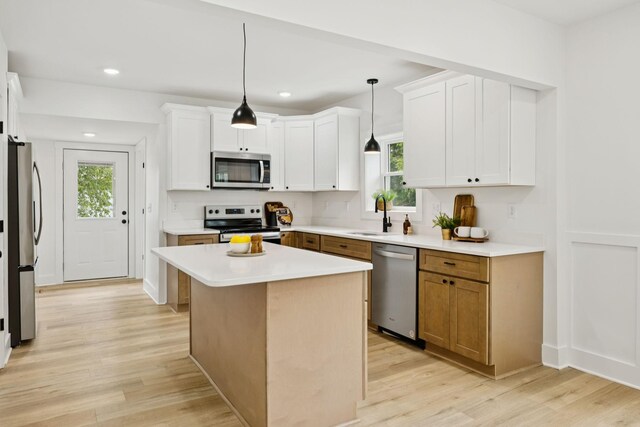 1775 Hayshed Rd, Charlotte, TN 37036 - kitchen with appliances with stainless steel finishes, healthy amount of natural light, light wood finished floors, and recessed lighting