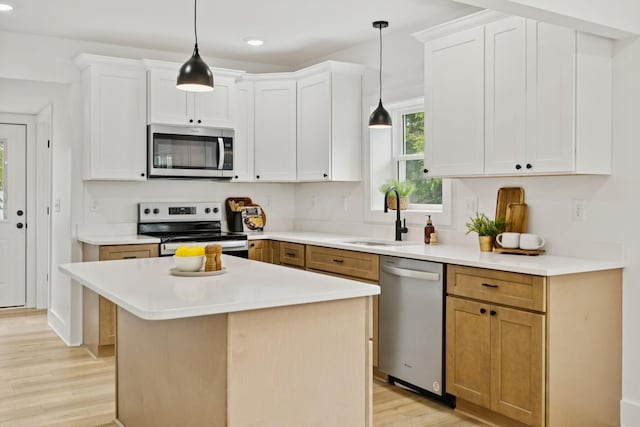 1775 Hayshed Rd, Charlotte, TN 37036 - kitchen featuring stainless steel appliances, light wood-style flooring, light countertops, white cabinetry, and recessed lighting