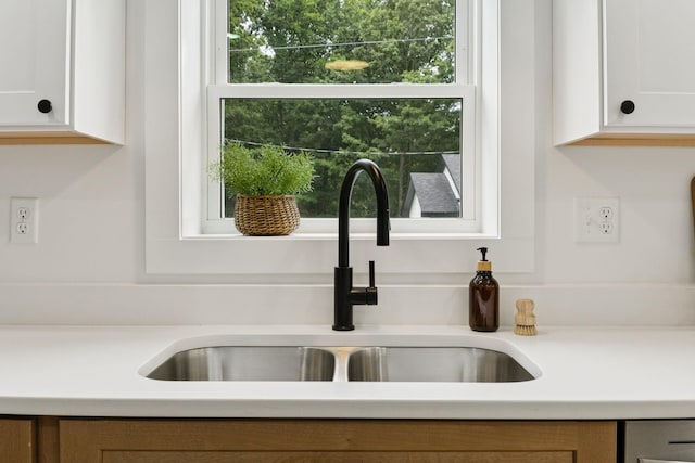 1775 Hayshed Rd, Charlotte, TN 37036 - kitchen featuring healthy amount of natural light, light countertops, and white cabinetry