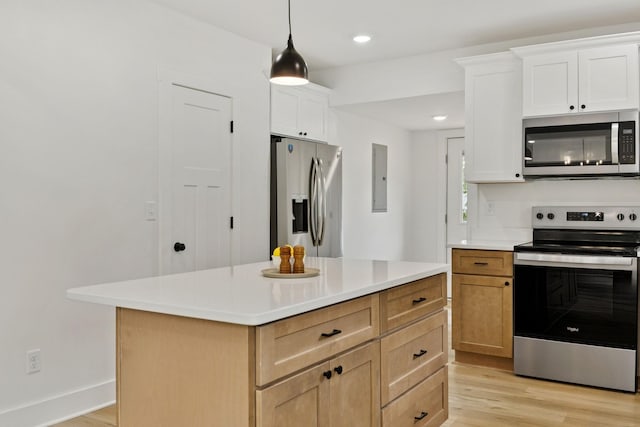 1775 Hayshed Rd, Charlotte, TN 37036 - kitchen featuring appliances with stainless steel finishes, light wood-style flooring, light countertops, electric panel, and white cabinets