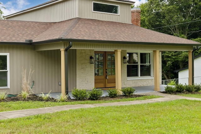 1775 Hayshed Rd, Charlotte, TN 37036 - view of front facade with roof with shingles, a porch, a front yard, and a chimney