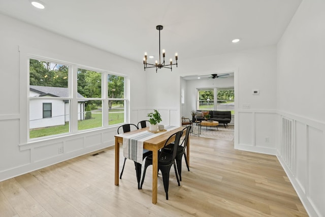 1775 Hayshed Rd, Charlotte, TN 37036 - dining area with a decorative wall, a chandelier, light wood-style floors, a wainscoted wall, and recessed lighting