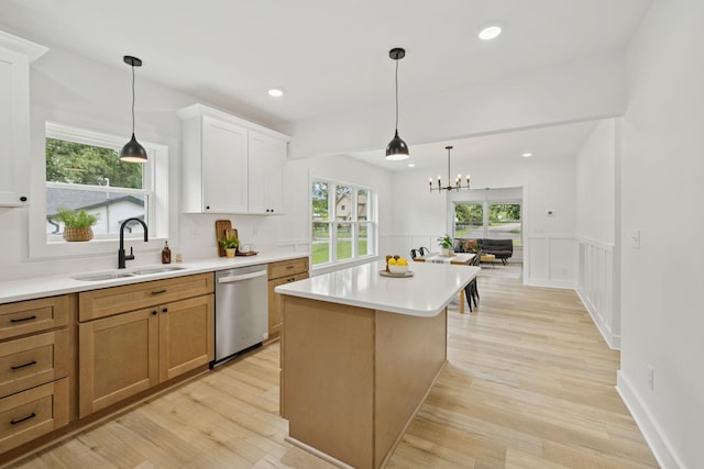 1775 Hayshed Rd, Charlotte, TN 37036 - kitchen featuring stainless steel dishwasher, light countertops, a wainscoted wall, light wood-style flooring, and recessed lighting