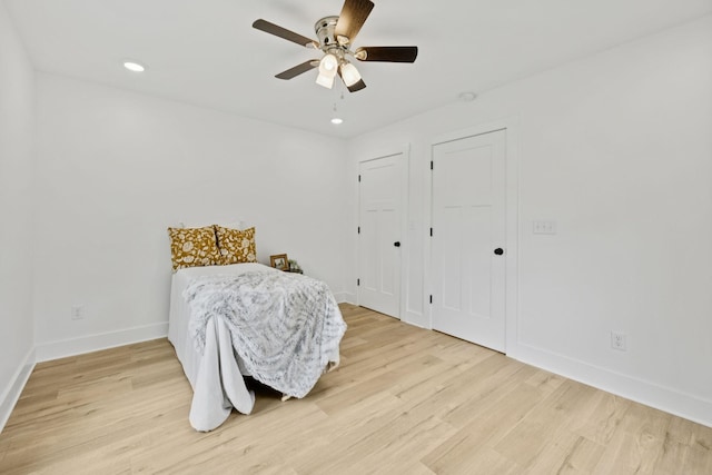 1775 Hayshed Rd, Charlotte, TN 37036 - bedroom with light wood-style flooring, recessed lighting, a ceiling fan, and multiple closets