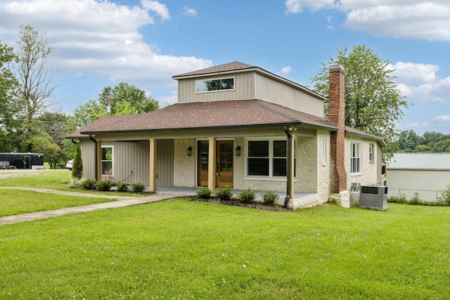 1775 Hayshed Rd, Charlotte, TN 37036 - view of front of property with a chimney, roof with shingles, a front yard, a porch, and stone siding