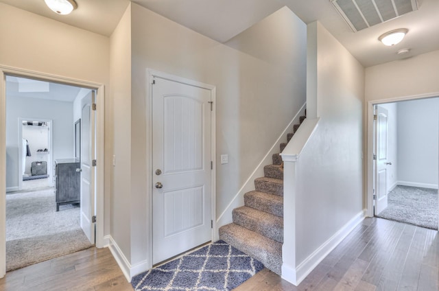 2009 Tulu Ct, Murfreesboro, TN 37128 - foyer entrance featuring wood finished floors, stairs, and baseboards