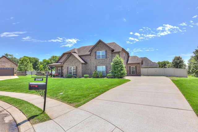 2009 Tulu Ct, Murfreesboro, TN 37128 - view of front of property featuring brick siding, a shingled roof, and driveway