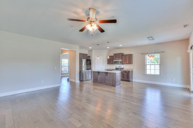 2009 Tulu Ct, Murfreesboro, TN 37128 - kitchen featuring appliances with stainless steel finishes, open floor plan, a center island with sink, plenty of natural light, and recessed lighting