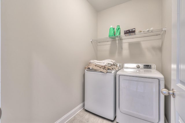 2009 Tulu Ct, Murfreesboro, TN 37128 - laundry room with washer and clothes dryer and baseboards