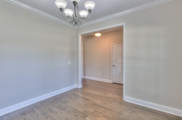 2009 Tulu Ct, Murfreesboro, TN 37128 - unfurnished room with a chandelier, crown molding, wood finished floors, and baseboards