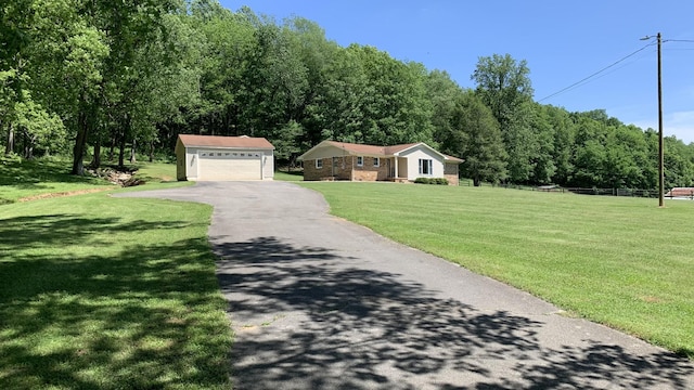 1020 Hams Creek Rd, Pulaski, TN 38478 - view of front of property with an outbuilding, asphalt driveway, and a front yard