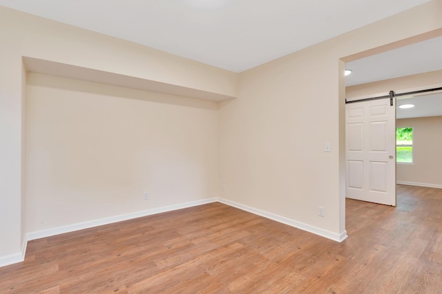 1318 Hwy S Unit 341, Chickamauga, GA 30707 - spare room featuring a barn door, light wood-style flooring, baseboards, and recessed lighting