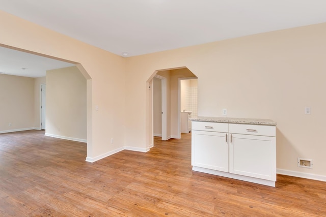 1318 Hwy S Unit 341, Chickamauga, GA 30707 - unfurnished room with light wood-style floors, baseboards, and arched walkways
