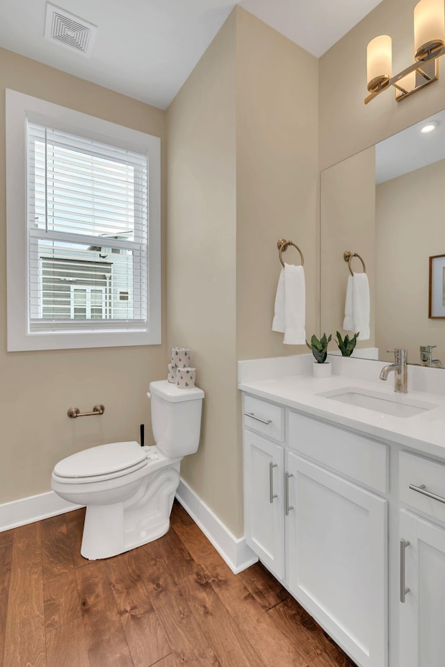 500 Creative Way Unit 16, Madison, TN 37115 - bathroom with toilet, vanity, baseboards, and wood finished floors