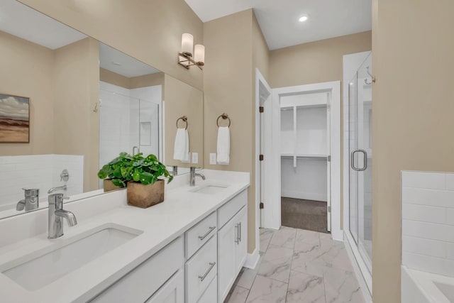 500 Creative Way Unit 16, Madison, TN 37115 - full bathroom with marble finish floors, a shower stall, double vanity, a bath, and a spacious closet