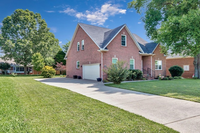 2710 Maylon Dr, Murfreesboro, TN 37128 - traditional-style house with an attached garage, brick siding, a front yard, and concrete driveway