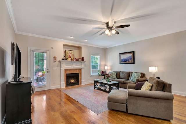 2710 Maylon Dr, Murfreesboro, TN 37128 - living room with ceiling fan, light wood finished floors, a tile fireplace, and ornamental molding