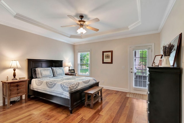 2710 Maylon Dr, Murfreesboro, TN 37128 - bedroom featuring multiple windows, light wood finished floors, a raised ceiling, access to exterior, and crown molding