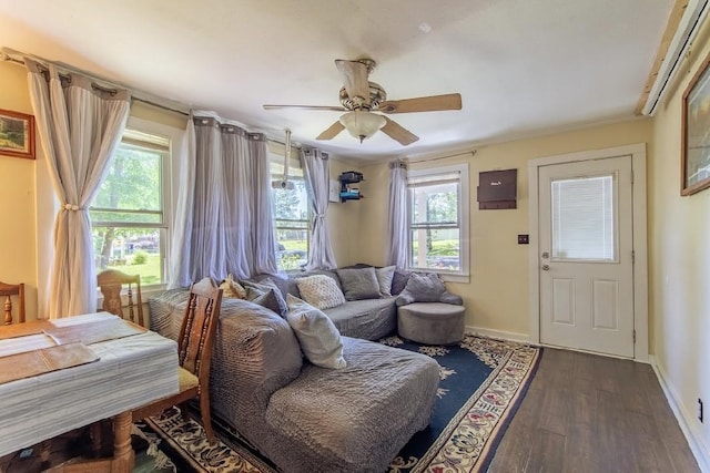 155 Thomas St, Savannah, TN 38372 - living room featuring plenty of natural light, dark wood-style floors, a ceiling fan, and baseboards