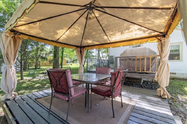 155 Thomas St, Savannah, TN 38372 - deck with a gazebo, outdoor dining space, and a yard