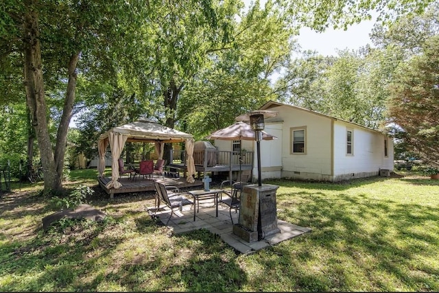 155 Thomas St, Savannah, TN 38372 - rear view of property with a gazebo, crawl space, a wooden deck, a lawn, and a patio