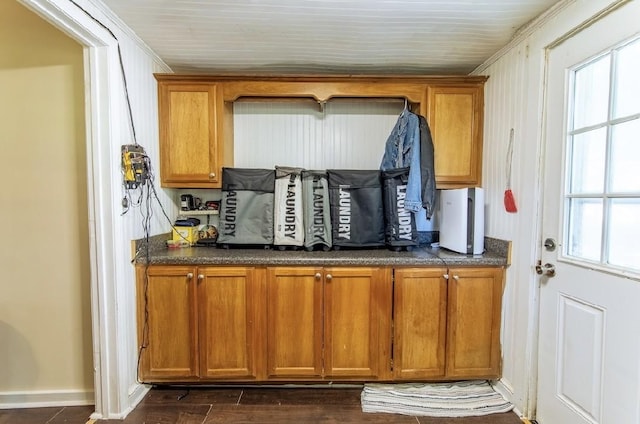 155 Thomas St, Savannah, TN 38372 - kitchen with brown cabinets, dark countertops, baseboards, healthy amount of natural light, and crown molding