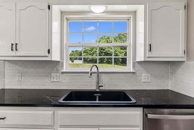 710 Krissy Ct, Columbia, TN 38401 - kitchen with a sink, stainless steel dishwasher, white cabinets, tasteful backsplash, and plenty of natural light