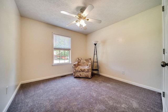 152 Cody Ct, Portland, TN 37148 - living area with dark carpet, a textured ceiling, ceiling fan, and baseboards