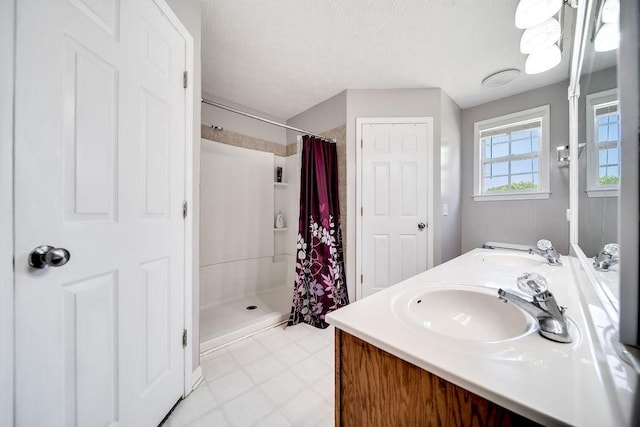 152 Cody Ct, Portland, TN 37148 - bathroom with a stall shower, double vanity, and a textured ceiling