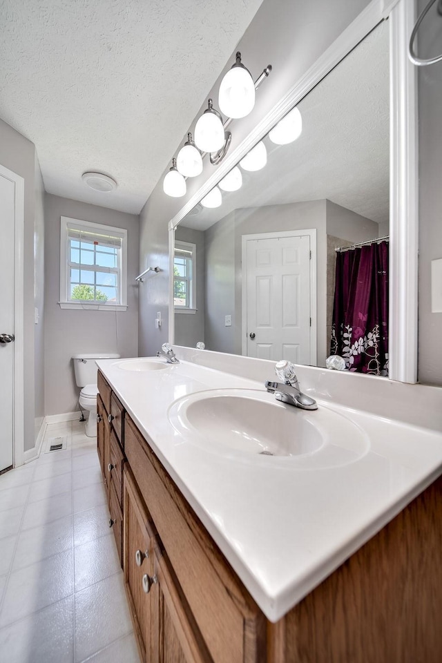 152 Cody Ct, Portland, TN 37148 - full bath with double vanity, a textured ceiling, toilet, baseboards, and a shower with curtain