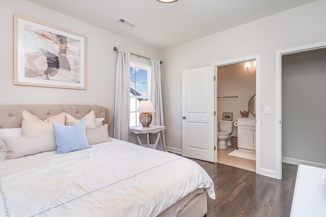 2036 Bocage Cir, Nolensville, TN 37135 - bedroom with dark wood finished floors, connected bathroom, and baseboards