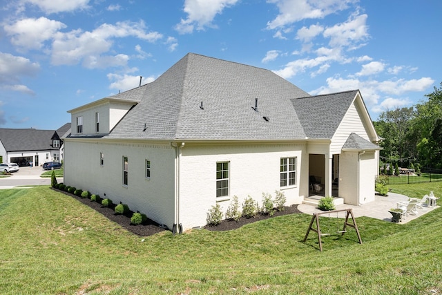 2036 Bocage Cir, Nolensville, TN 37135 - back of property featuring a yard, a shingled roof, and a patio area
