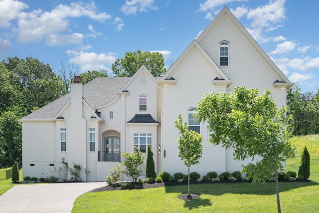 2036 Bocage Cir, Nolensville, TN 37135 - french country home featuring a front yard, a chimney, and french doors