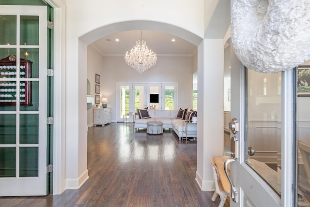 2036 Bocage Cir, Nolensville, TN 37135 - foyer with arched walkways, french doors, a chandelier, ornamental molding, and dark wood finished floors