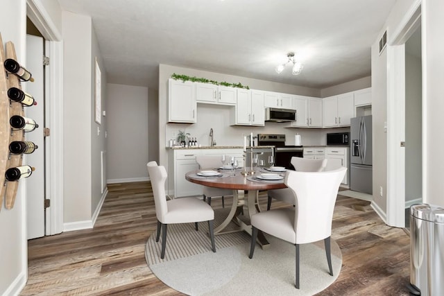 2640 Queen Anne Ct, Springfield, TN 37172 - dining space featuring wood finished floors and baseboards