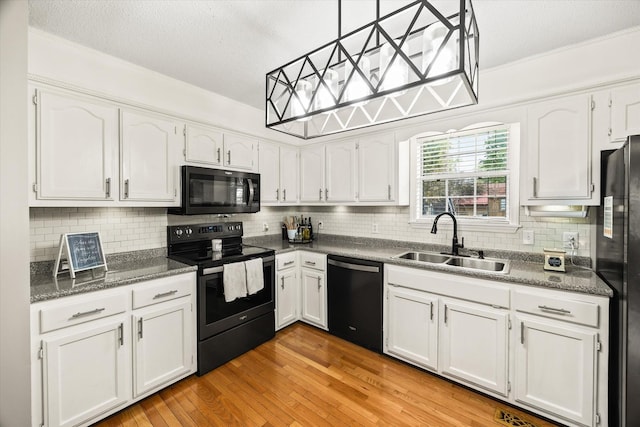 3571 Southmeade Dr, Cookeville, TN 38506 - kitchen featuring black appliances, a sink, white cabinets, decorative backsplash, and ornamental molding