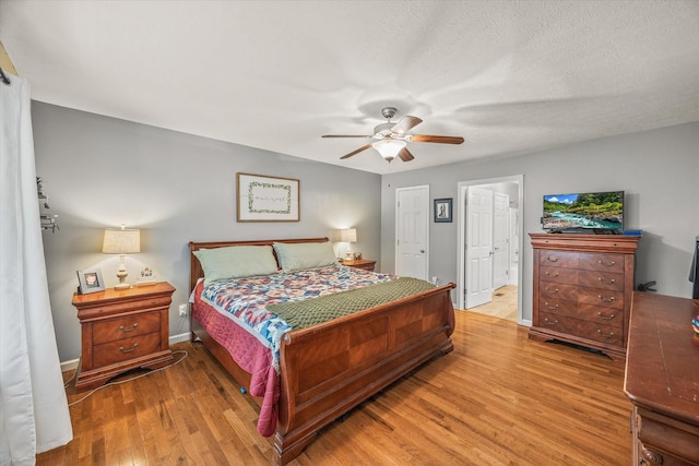 1531 Lake Villa Cir, Cookeville, TN 38506 - bedroom featuring light wood finished floors, a ceiling fan, ensuite bathroom, and baseboards