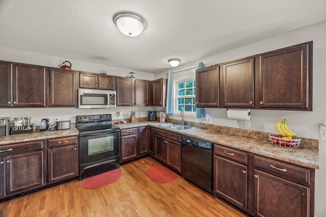 1531 Lake Villa Cir, Cookeville, TN 38506 - kitchen with black appliances, a sink, light wood finished floors, and dark brown cabinets